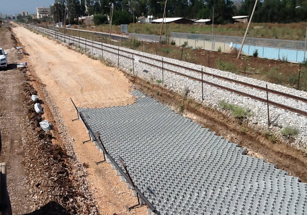 Load support of roads and railways bases by Tough cells Neoloy and biaxial geogrids - Akko- Nahariya railway